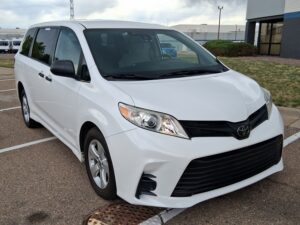 White Toyota Sienna with Driverge Rear Entry Manual Fold Out conversion