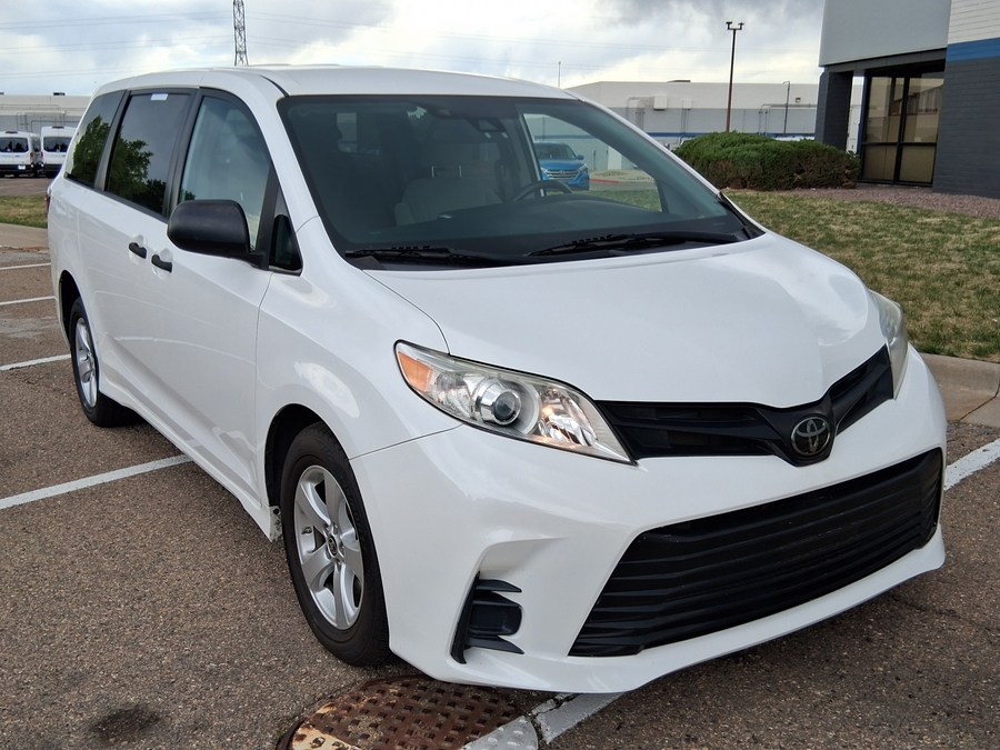 White Toyota Sienna with Driverge Rear Entry Manual Fold Out conversion