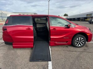 Red Honda Odyssey with BraunAbility Side Entry Automatic In Floor conversion