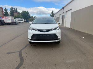 White Toyota Sienna with BraunAbility Side Entry Automatic Fold Out conversion