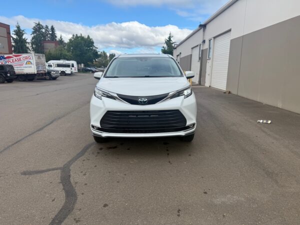 White Toyota Sienna with BraunAbility Side Entry Automatic Fold Out conversion