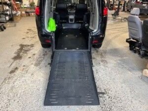 Black Chrysler Voyager with BraunAbility Rear Entry Manual Fold Out conversion