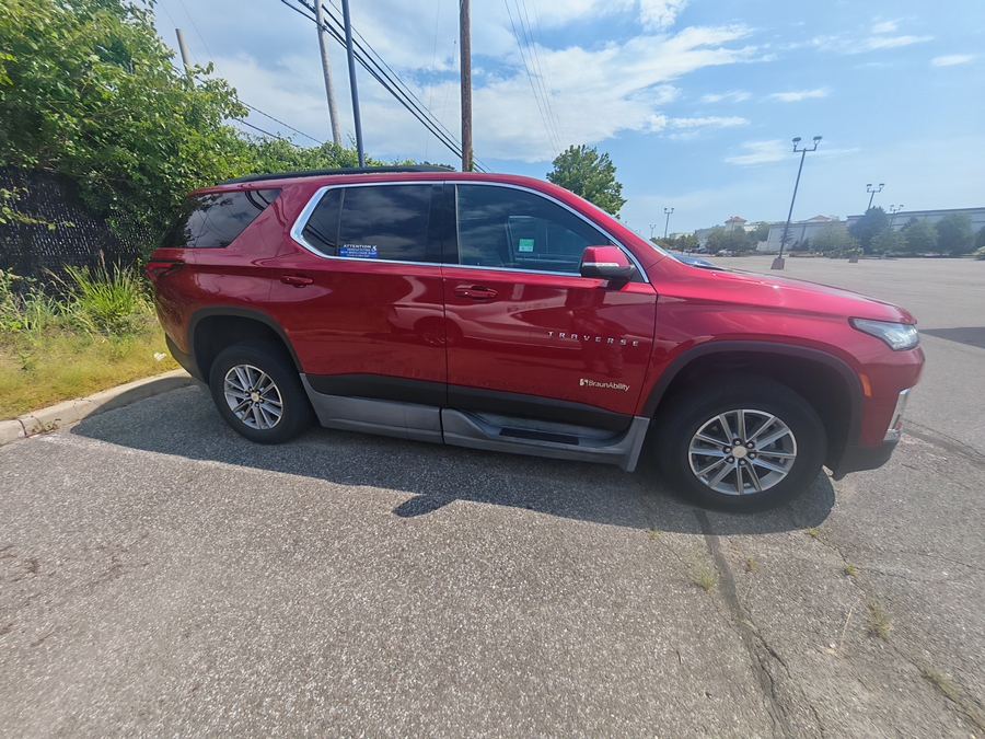 Red Chevrolet Traverse with BraunAbility Side Entry Automatic In Floor conversion