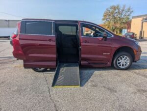 Red Chrysler Pacifica with Driverge Side Entry Automatic Fold Out conversion