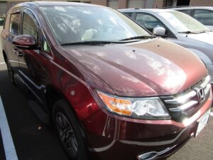 Red Honda Odyssey with Vantage Mobility Side Entry Automatic In Floor conversion
