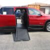 Red Chevrolet Traverse with BraunAbility Side Entry Automatic In Floor conversion
