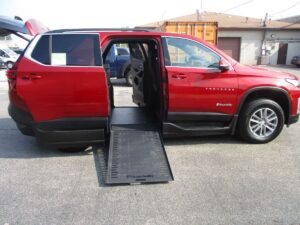 Red Chevrolet Traverse with BraunAbility Side Entry Automatic In Floor conversion