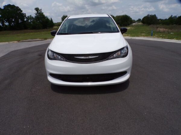 White Chrysler Voyager with Driverge Side Entry Automatic Fold Out conversion