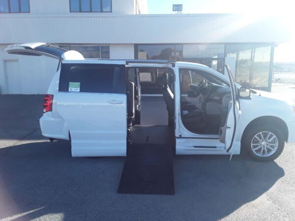 White Dodge Grand Caravan with BraunAbility Side Entry Automatic Fold Out conversion