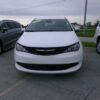 White Chrysler Voyager with Freedom Motors Rear Entry Manual Fold Out conversion