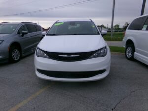 White Chrysler Voyager with Freedom Motors Rear Entry Manual Fold Out conversion