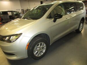 Silver Chrysler Voyager with BraunAbility Rear Entry Manual Fold Out conversion