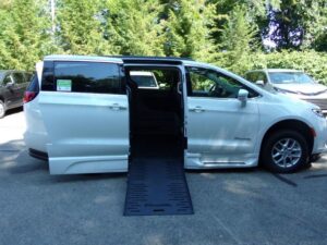 White Chrysler Pacifica with BraunAbility Side Entry Automatic Fold Out conversion