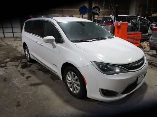 White Chrysler Pacifica with Driverge Rear Entry Manual Fold Out conversion