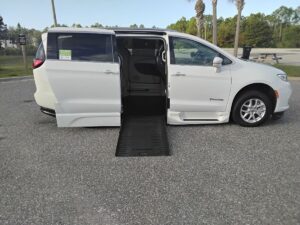 White Chrysler Pacifica with BraunAbility Side Entry Automatic Fold Out conversion