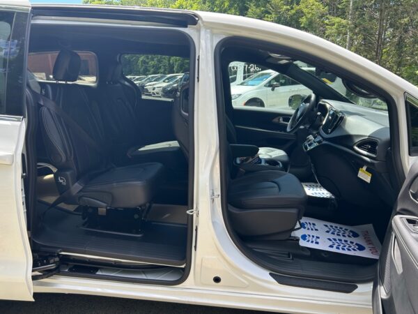 White Chrysler Voyager with BraunAbility Rear Entry Manual Fold Out conversion