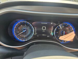 White Chrysler Pacifica with BraunAbility Side Entry Automatic Fold Out conversion