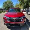 Red Chevrolet Traverse with BraunAbility Side Entry Automatic In Floor conversion