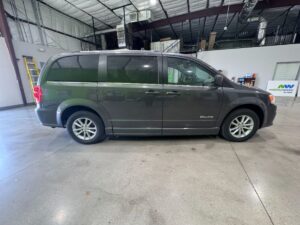 Grey Dodge Grand Caravan with BraunAbility Side Entry Automatic Fold Out conversion