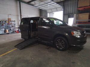 Grey Dodge Grand Caravan with BraunAbility Side Entry Automatic Fold Out conversion