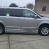 Silver Dodge Grand Caravan with BraunAbility Side Entry Automatic Fold Out conversion