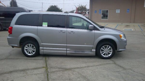 Silver Dodge Grand Caravan with BraunAbility Side Entry Automatic Fold Out conversion