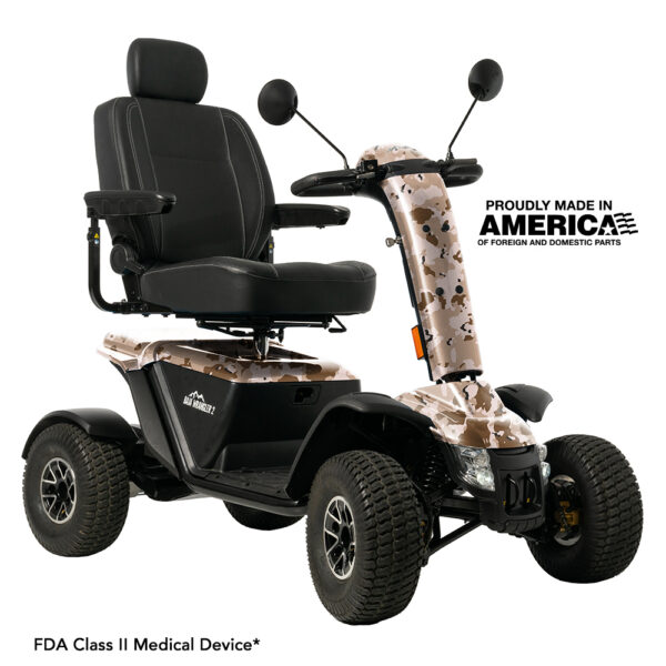 Four-wheel mobility scooter with camouflage detailing, black seat, armrests, and backrest. Text indicates it is made in America and is an FDA Class II medical device.