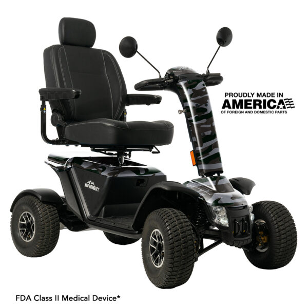 A four-wheel mobility scooter with a black seat and camouflage-patterned front, featuring armrests, mirrors, and labeled as an FDA Class II medical device.