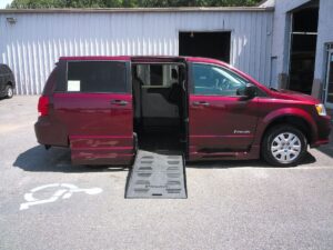 Red Dodge Grand Caravan with BraunAbility Side Entry Automatic Fold Out conversion