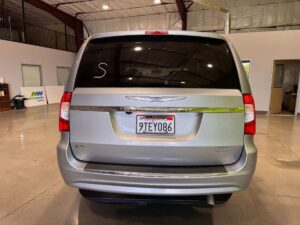 Silver Chrysler Town and Country with BraunAbility Side Entry Automatic Fold Out conversion