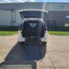 White Chrysler Pacifica with Driverge Rear Entry Manual Fold Out conversion