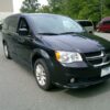 Black Dodge Grand Caravan with BraunAbility Side Entry Automatic Fold Out conversion