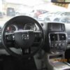 Black Dodge Grand Caravan with Driverge Side Entry Automatic Fold Out conversion