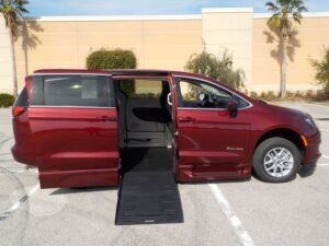 Red Chrysler Voyager with BraunAbility Side Entry Automatic Fold Out conversion