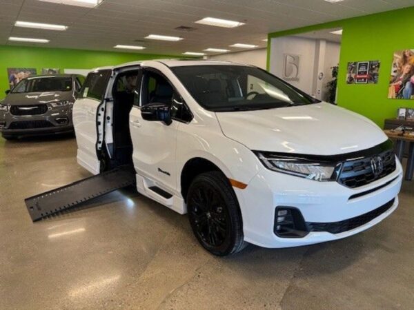White Honda Odyssey with BraunAbility Side Entry Automatic In Floor conversion