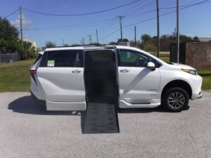 White Toyota Sienna with BraunAbility Side Entry Automatic Fold Out conversion