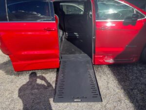Red Chrysler Pacifica with BraunAbility Side Entry Automatic In Floor conversion