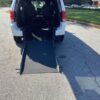 White Dodge Grand Caravan with Driverge Rear Entry Manual Fold Out conversion