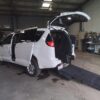 White Chrysler Voyager with BraunAbility Rear Entry Manual Fold Out conversion