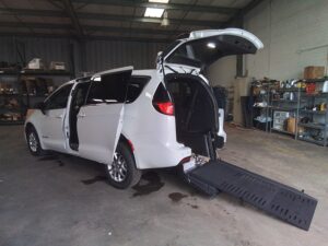 White Chrysler Voyager with BraunAbility Rear Entry Manual Fold Out conversion
