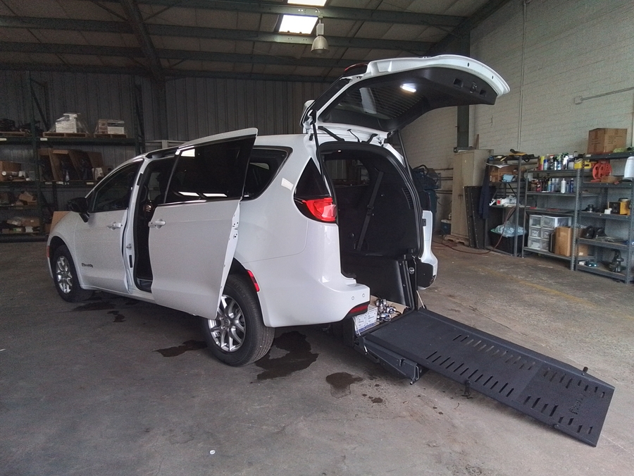 White Chrysler Voyager with BraunAbility Rear Entry Manual Fold Out conversion