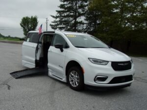 White Chrysler Pacifica with BraunAbility Side Entry Automatic Fold Out conversion