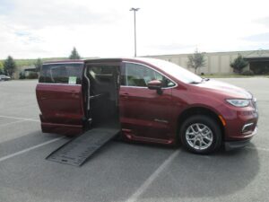 Red Chrysler Pacifica with BraunAbility Side Entry Automatic Fold Out conversion
