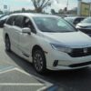 White Honda Odyssey with BraunAbility Side Entry Automatic In Floor conversion
