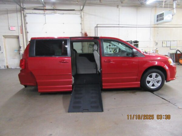 Red Dodge Grand Caravan with BraunAbility Side Entry Automatic Fold Out conversion