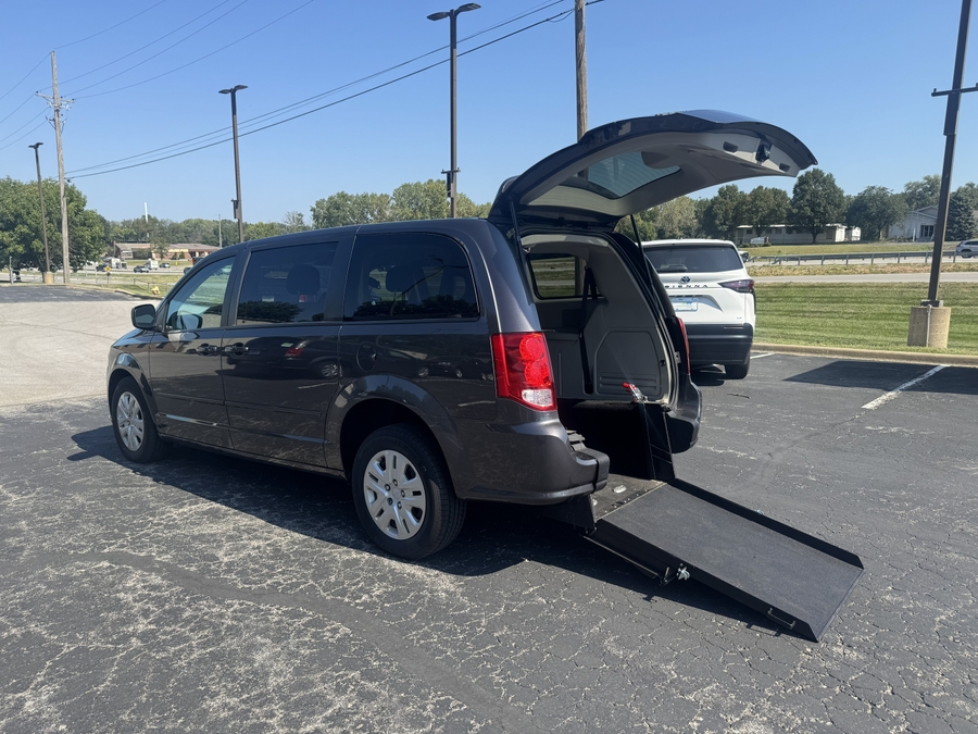 Grey Dodge Grand Caravan with International Sales and Mobility Rear Entry Manual Fold Out conversion
