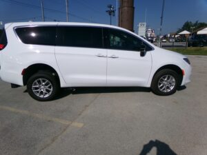 White Chrysler Voyager with FR Conversions Rear Entry Manual Fold Out conversion