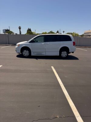 White Dodge Grand Caravan with BraunAbility Side Entry Automatic Fold Out conversion