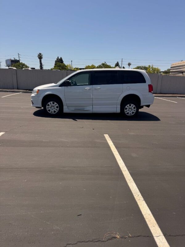 White Dodge Grand Caravan with BraunAbility Side Entry Automatic Fold Out conversion