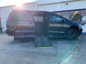 Black Chrysler Pacifica with Driverge Side Entry Automatic Fold Out conversion